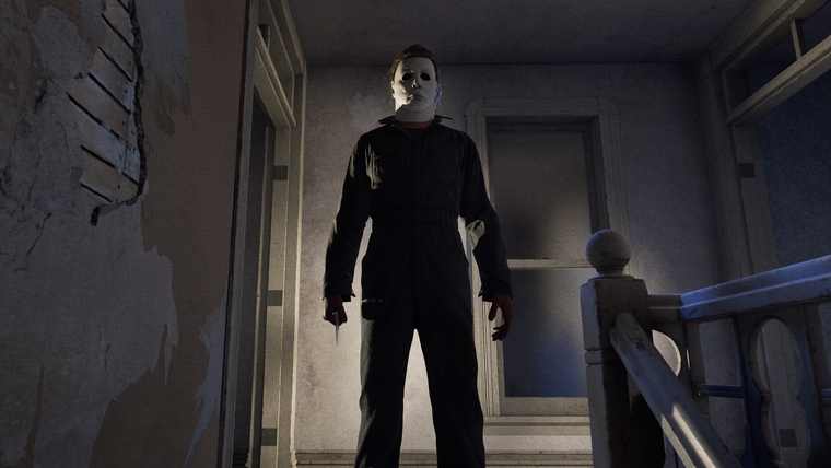 Michael Myers standing in a doorway holding a knife